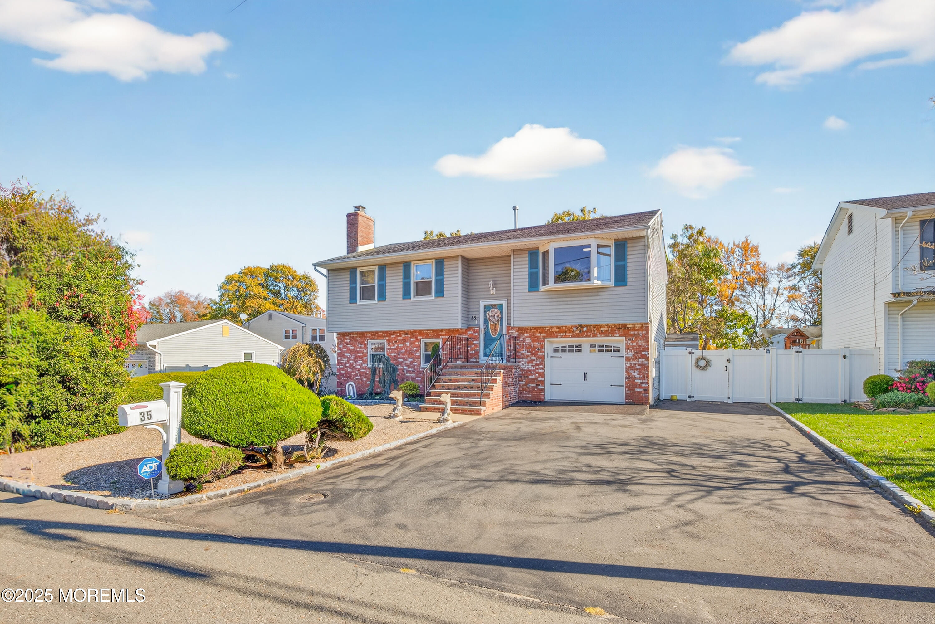 35 Heather Road Toms River, NJ 08753 - Photo 4 of 40 a view of a house with a yard and a garage