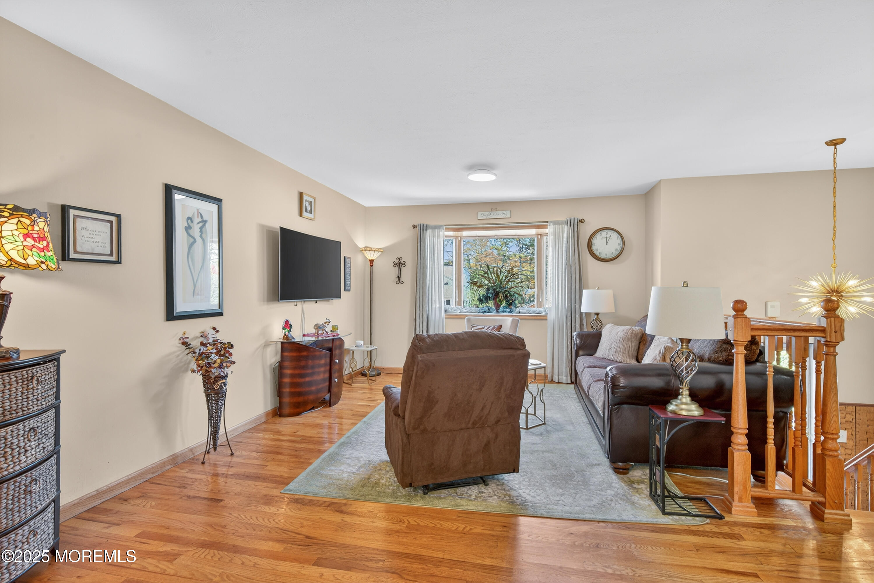 35 Heather Road Toms River, NJ 08753 - Photo 7 of 40 a living room with furniture flat screen tv and wooden floor