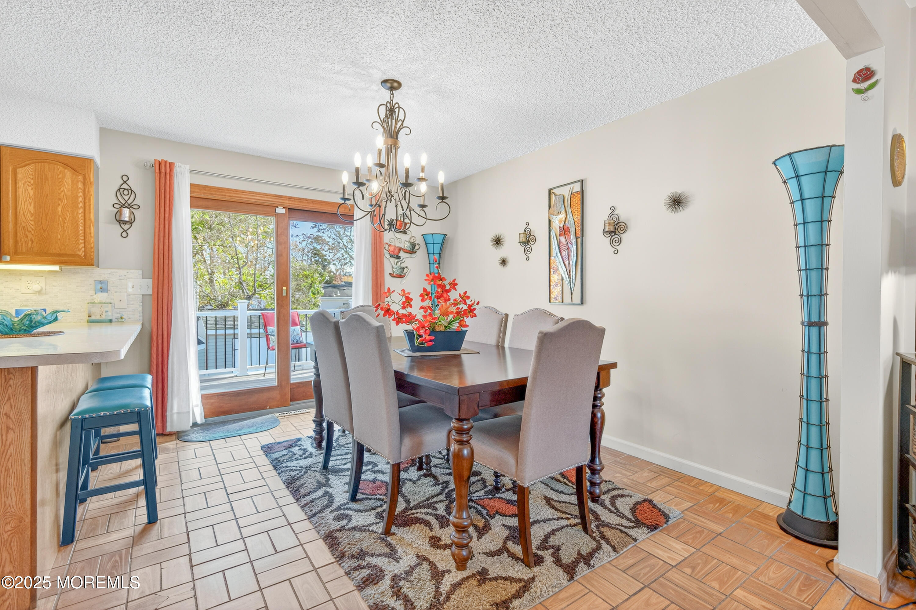 35 Heather Road Toms River, NJ 08753 - Photo 9 of 40 a dining room with furniture a chandelier and wooden floor