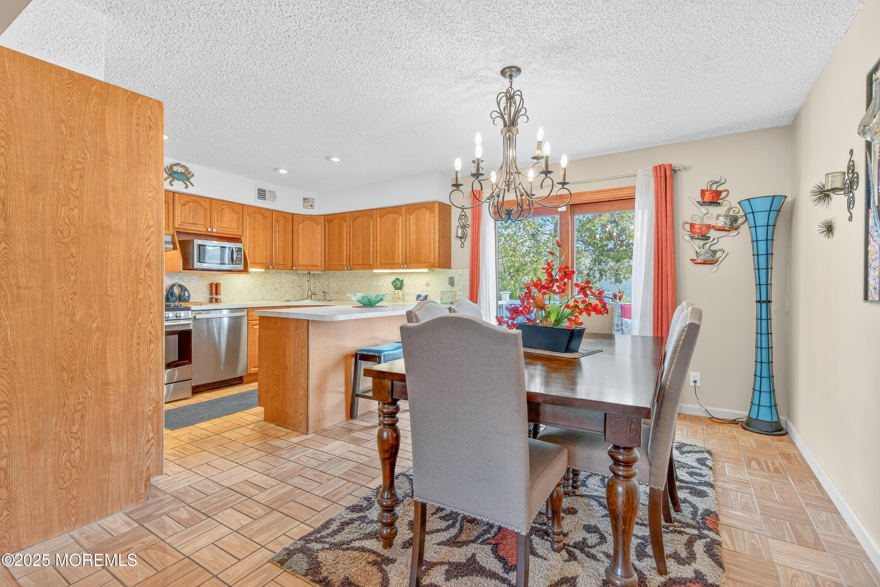 35 Heather Road Toms River, NJ 08753 - Photo 10 of 40 a view of a dining room with furniture a chandelier and wooden floor