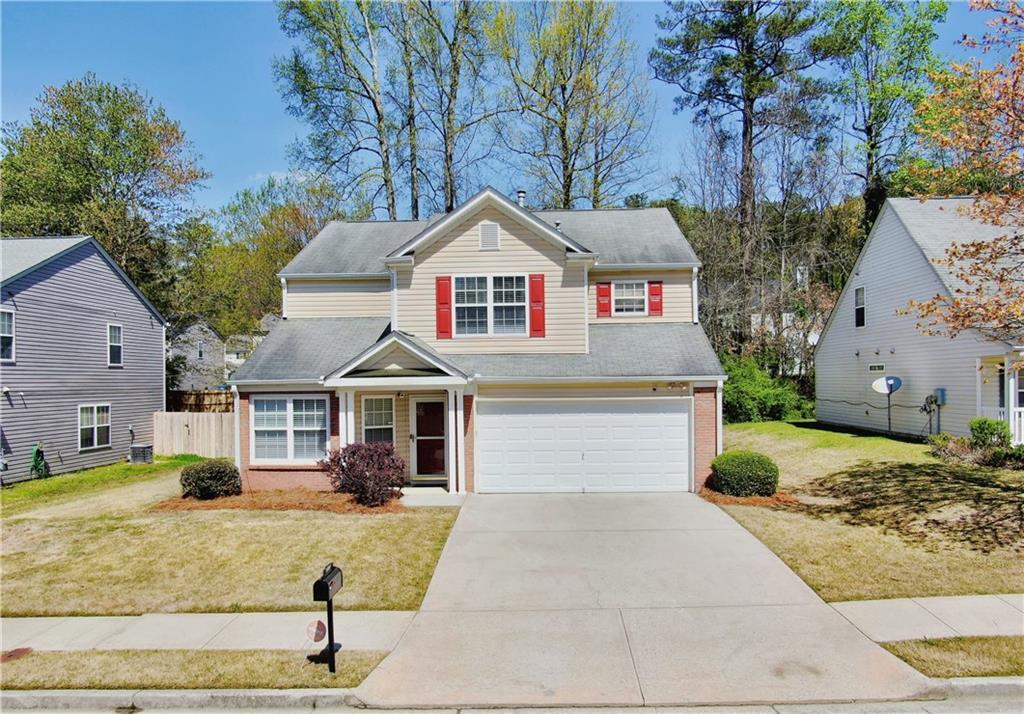3076 Sable Run Road Atlanta, GA 30349 - Photo 1 of 1 a front view of a house with garden