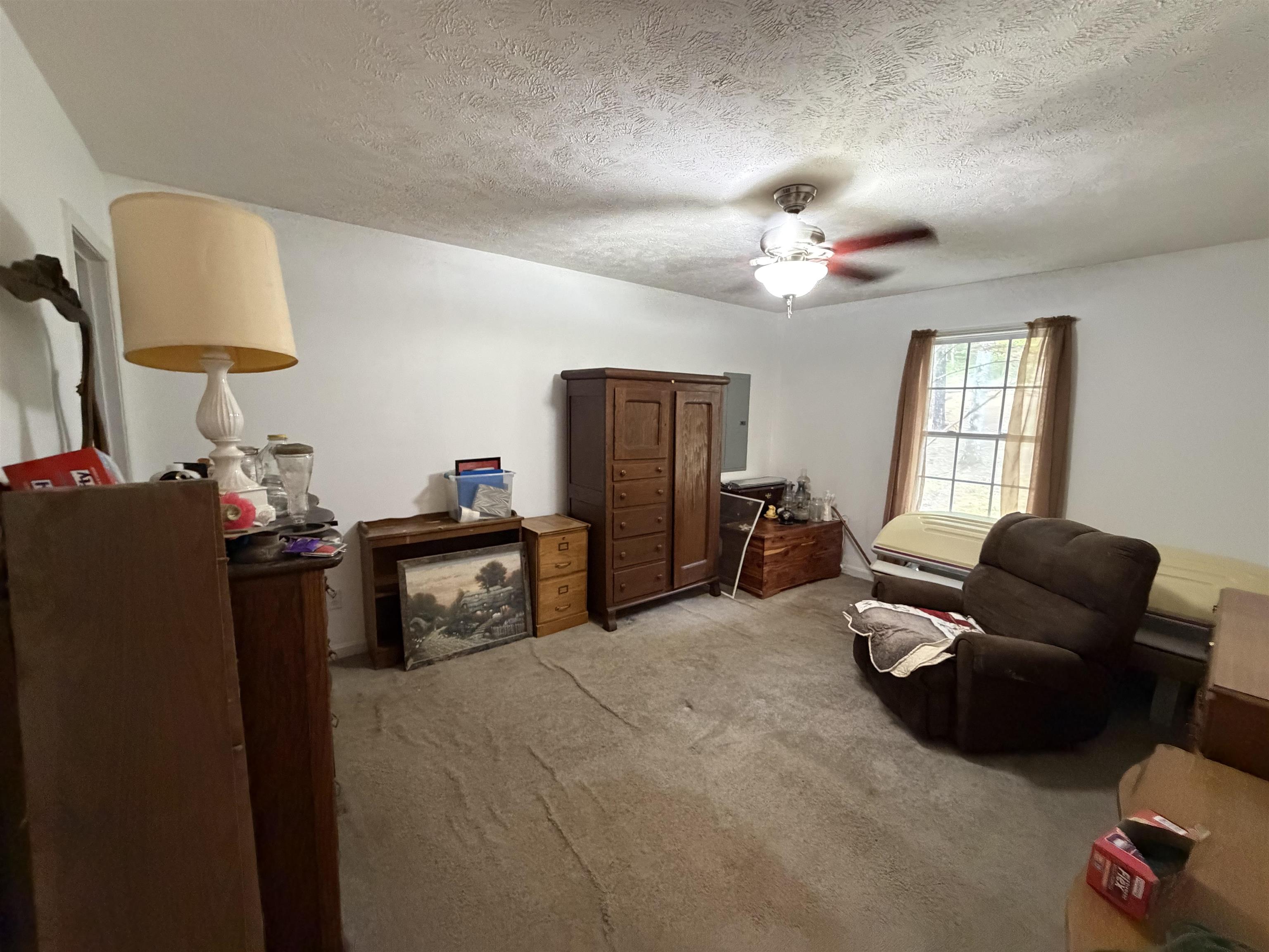 191 Crabtree Road Selmer, TN 38375 - Photo 12 of 18 a bedroom with bed and a couch