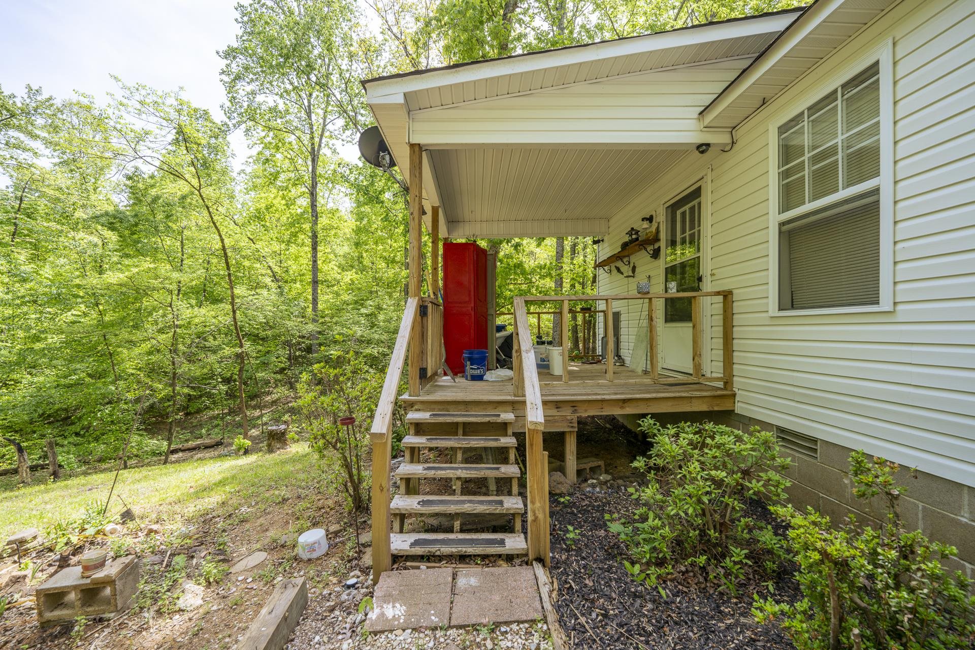 191 Crabtree Road Selmer, TN 38375 - Photo 15 of 18 a front view of a house with a yard