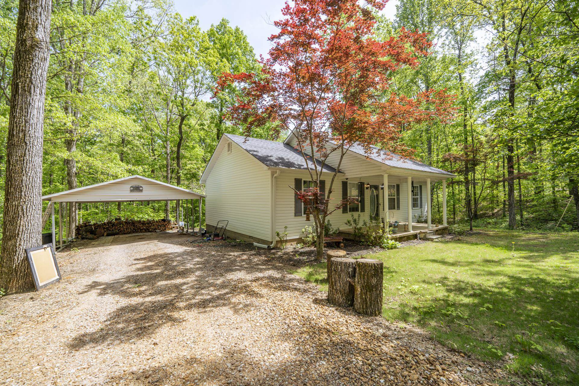 191 Crabtree Road Selmer, TN 38375 - Photo 2 of 18 a view of a house with backyard and sitting area