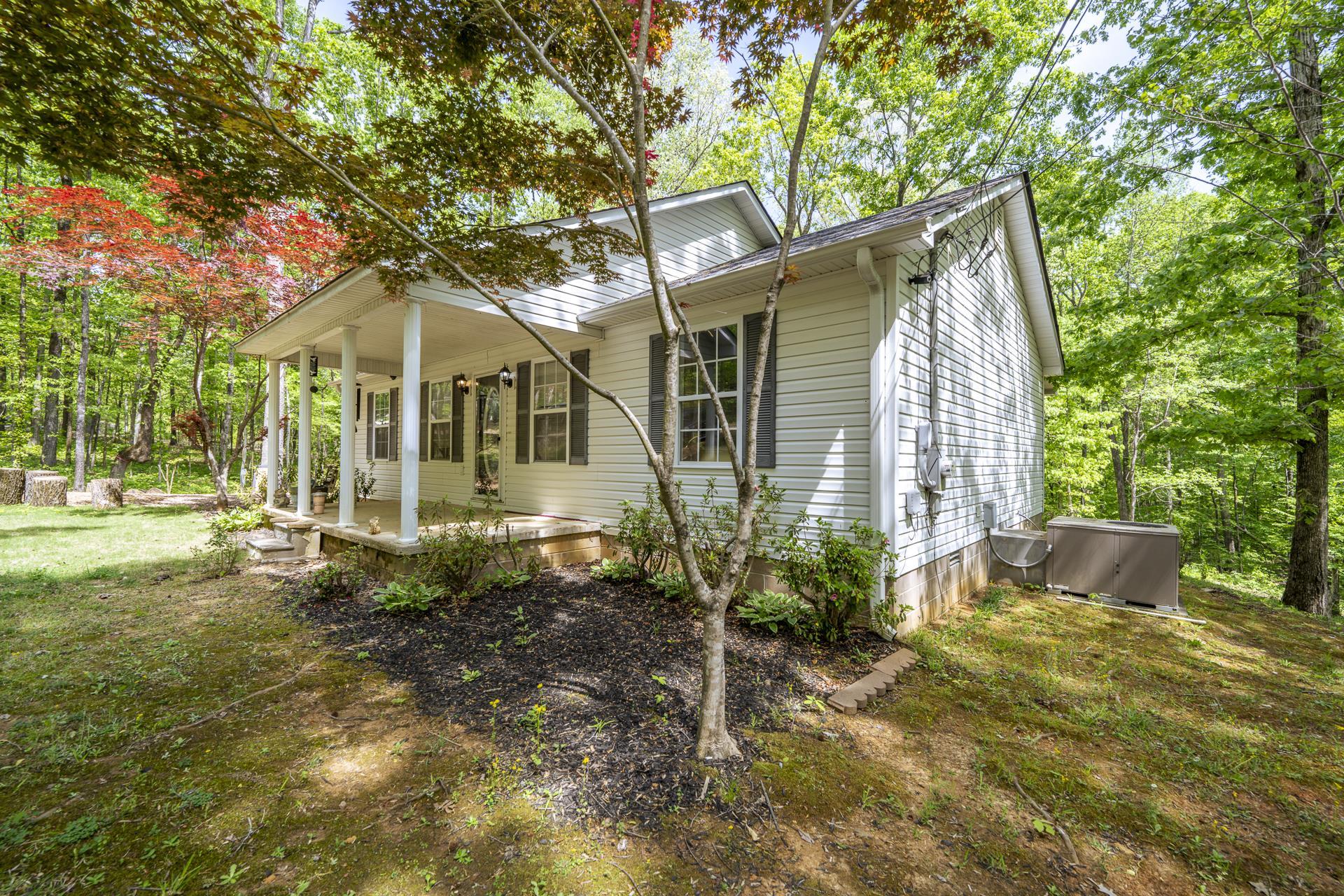 191 Crabtree Road Selmer, TN 38375 - Photo 3 of 18 a front view of a house with garden