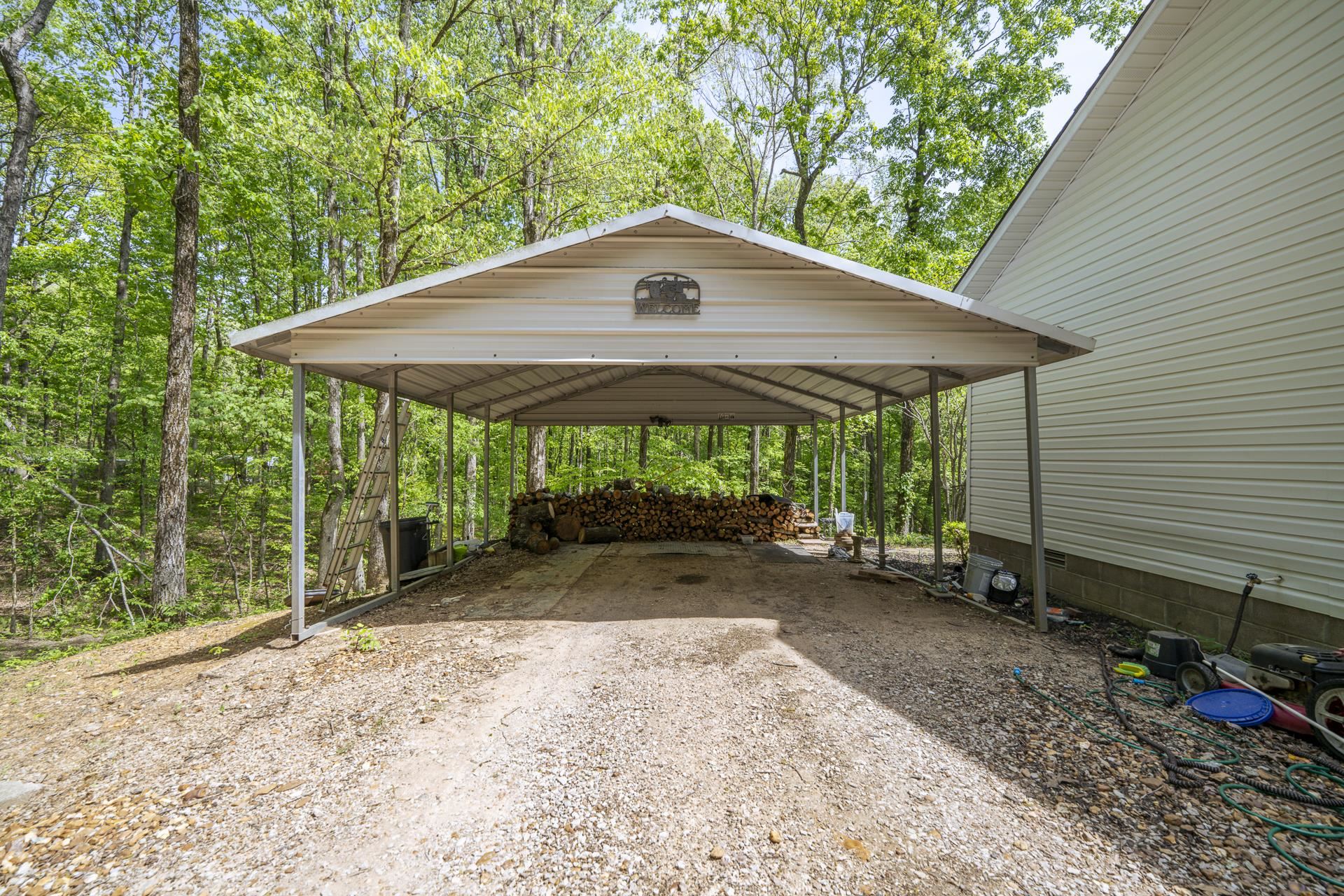 191 Crabtree Road Selmer, TN 38375 - Photo 4 of 18 a backyard of a house with barbeque oven table and chairs