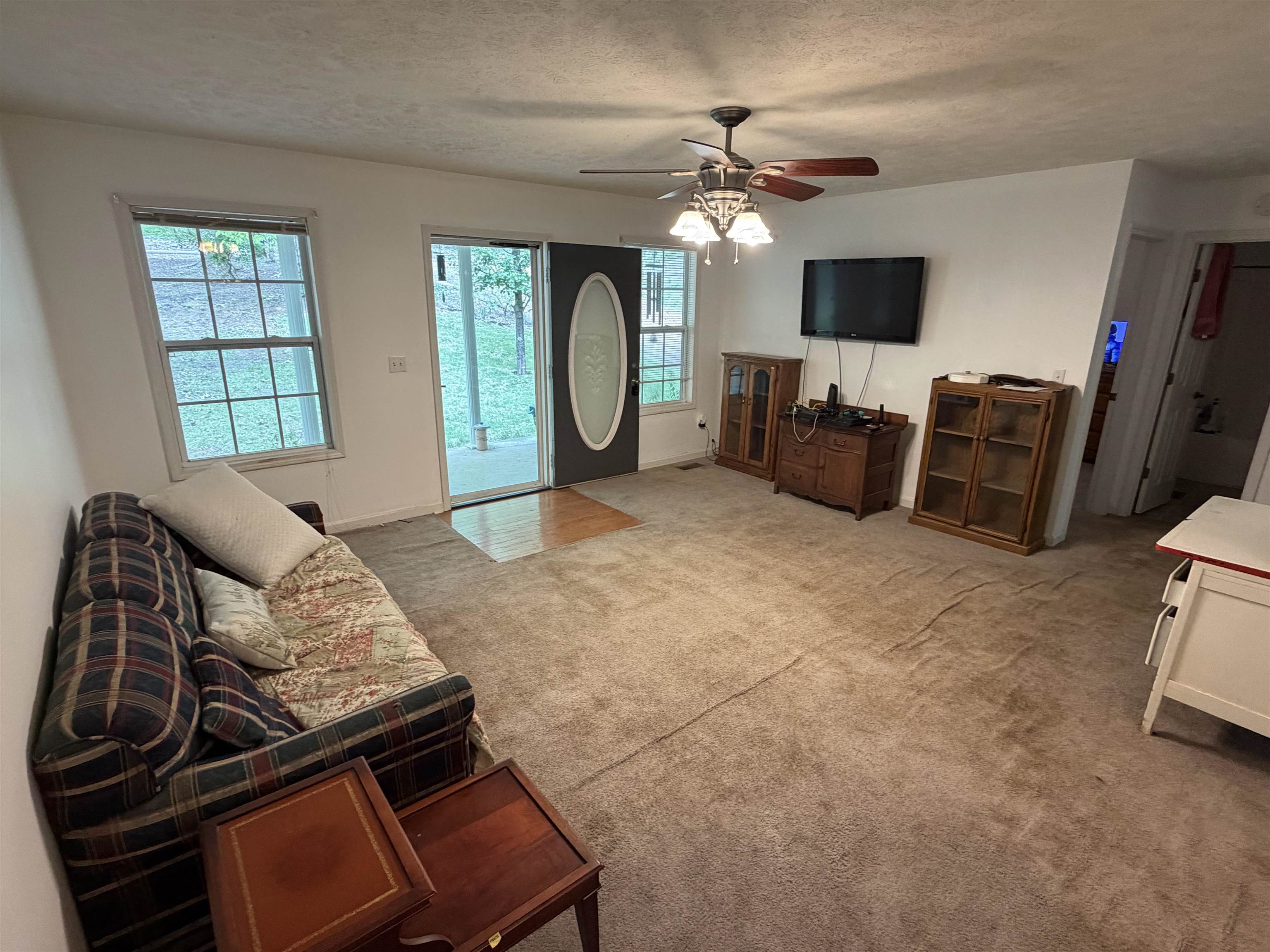 191 Crabtree Road Selmer, TN 38375 - Photo 6 of 18 a living room with furniture and a flat screen tv