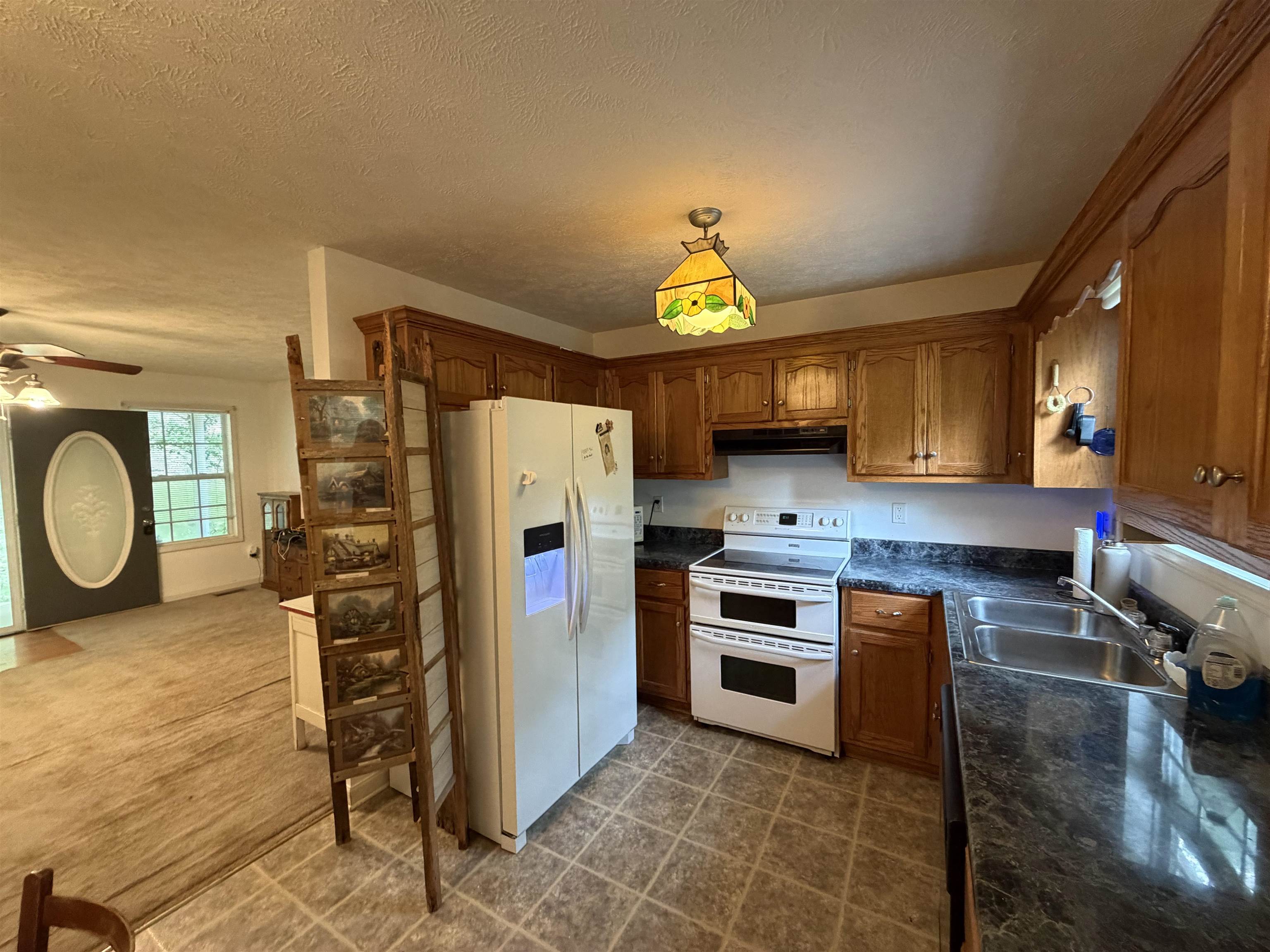 191 Crabtree Road Selmer, TN 38375 - Photo 9 of 18 a kitchen with stainless steel appliances granite countertop a stove a refrigerator and a stove