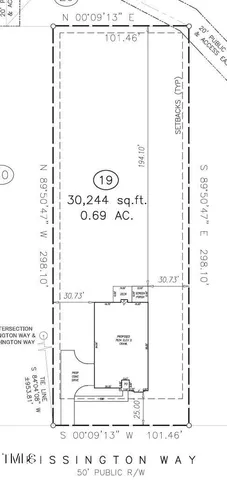 an empty room with wooden floor and white walls