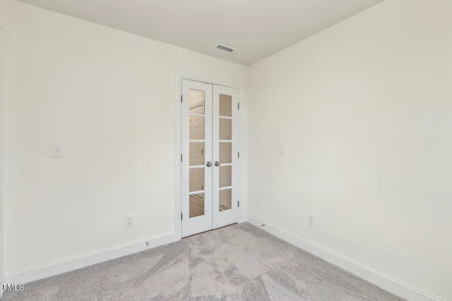 a kitchen with kitchen island granite countertop a sink a counter top space stainless steel appliances and cabinets