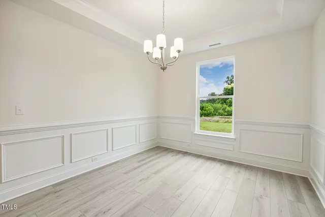 a kitchen with a sink a stove a microwave and cabinets