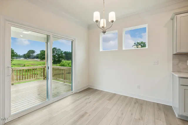 a view of kitchen with wooden floor and window