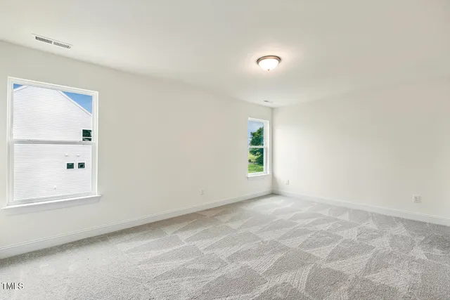 a view of a balcony with wooden floor
