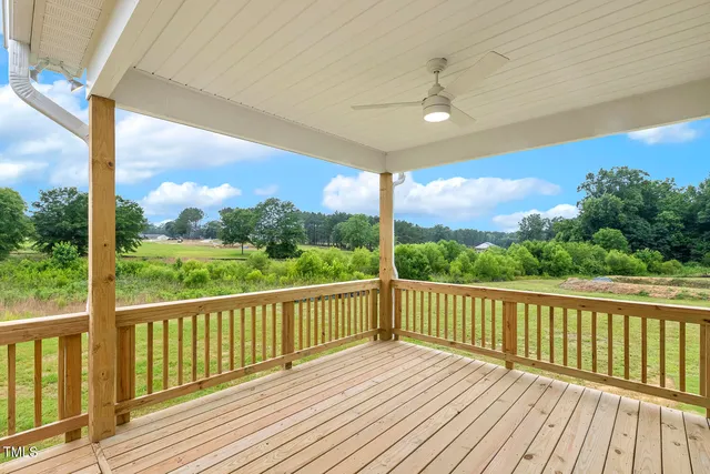 a house that has a big yard and a large tree