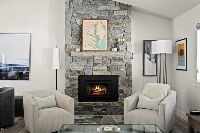 a living room with furniture a window and a fireplace