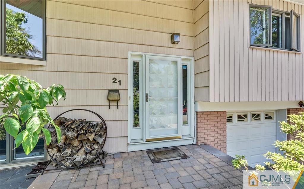 21 Peake Road Edison, NJ 08837 - Photo 3 of 24 a front view of a house with a garden