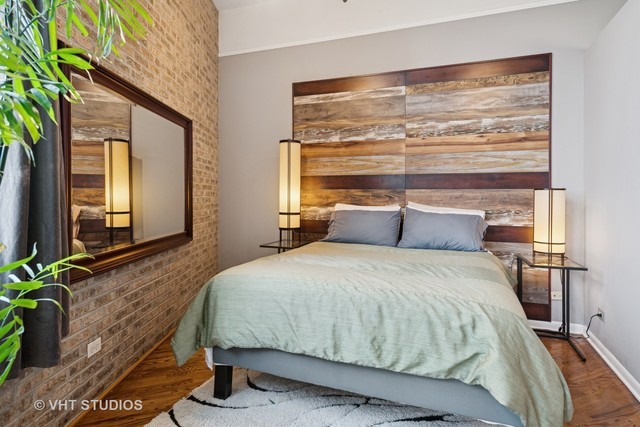 2222 West Diversey Avenue, Unit 407 Chicago, IL 60647 - Photo 13 of 30 a bedroom with a bed and window