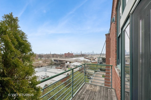 2222 West Diversey Avenue, Unit 407 Chicago, IL 60647 - Photo 16 of 30 a view of a balcony with city view