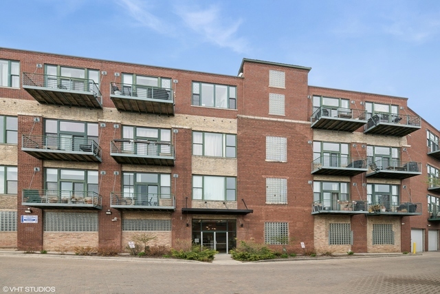 2222 West Diversey Avenue, Unit 407 Chicago, IL 60647 - Photo 2 of 30 a front view of residential building