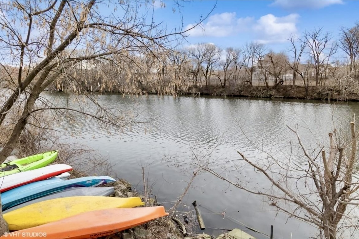 2222 West Diversey Avenue, Unit 407 Chicago, IL 60647 - Photo 26 of 30 a view of swimming pool with a yard and lake view