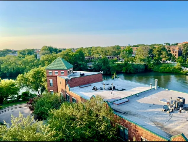 an aerial view of a house with outdoor space lake view and mountain view