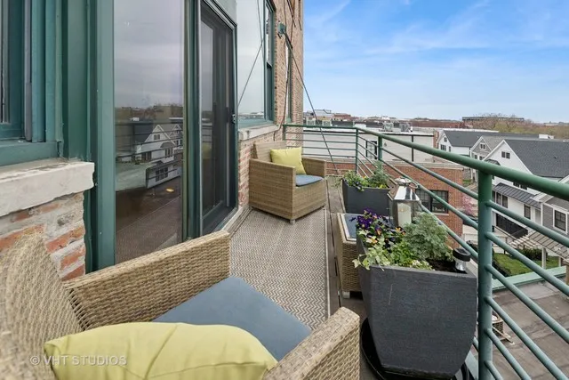 a view of balcony with furniture