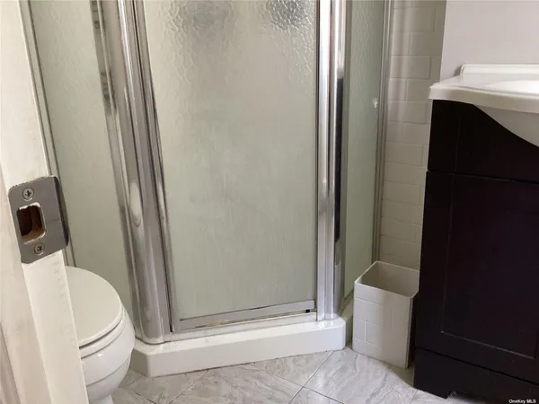 a bathroom with a sink and toilet