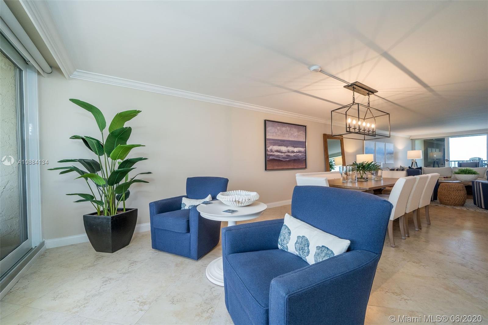 19900 South Beach Road, Unit 803 Jupiter, FL 33469 - Photo 14 of 64 a living room with furniture potted plant and a window