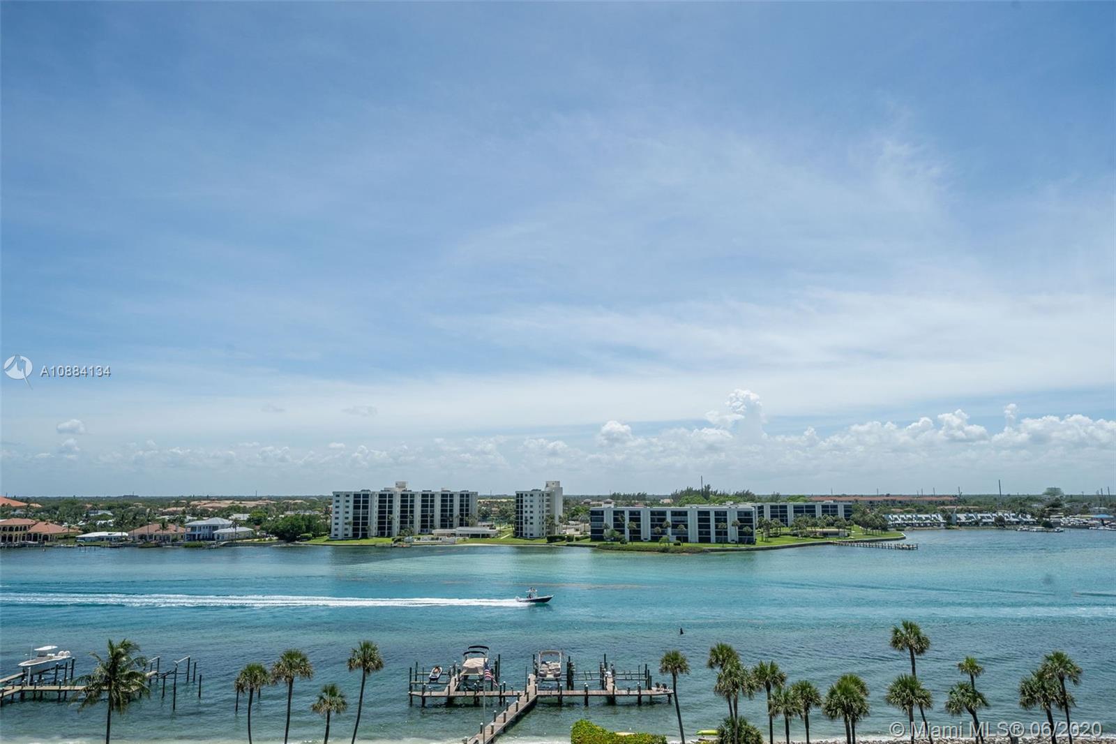 19900 South Beach Road, Unit 803 Jupiter, FL 33469 - Photo 24 of 64 a view of a lake with houses in the back