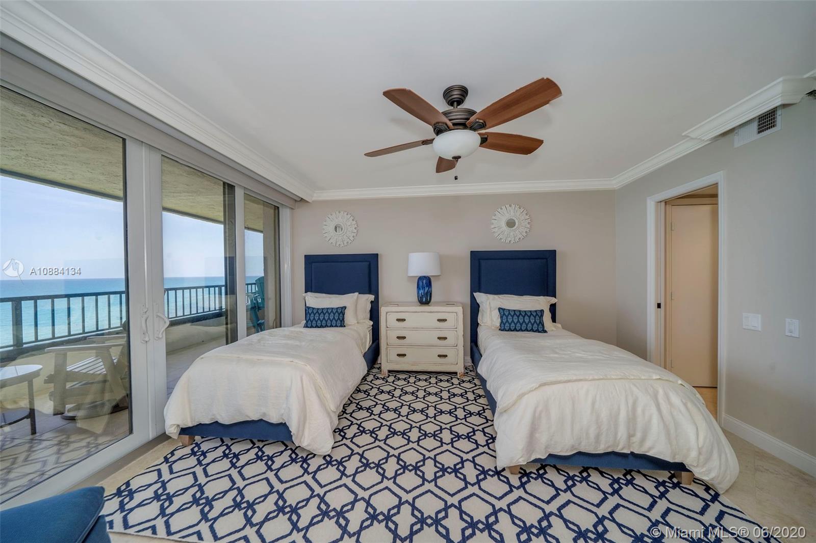 19900 South Beach Road, Unit 803 Jupiter, FL 33469 - Photo 27 of 64 a bedroom with a large bed and a large window