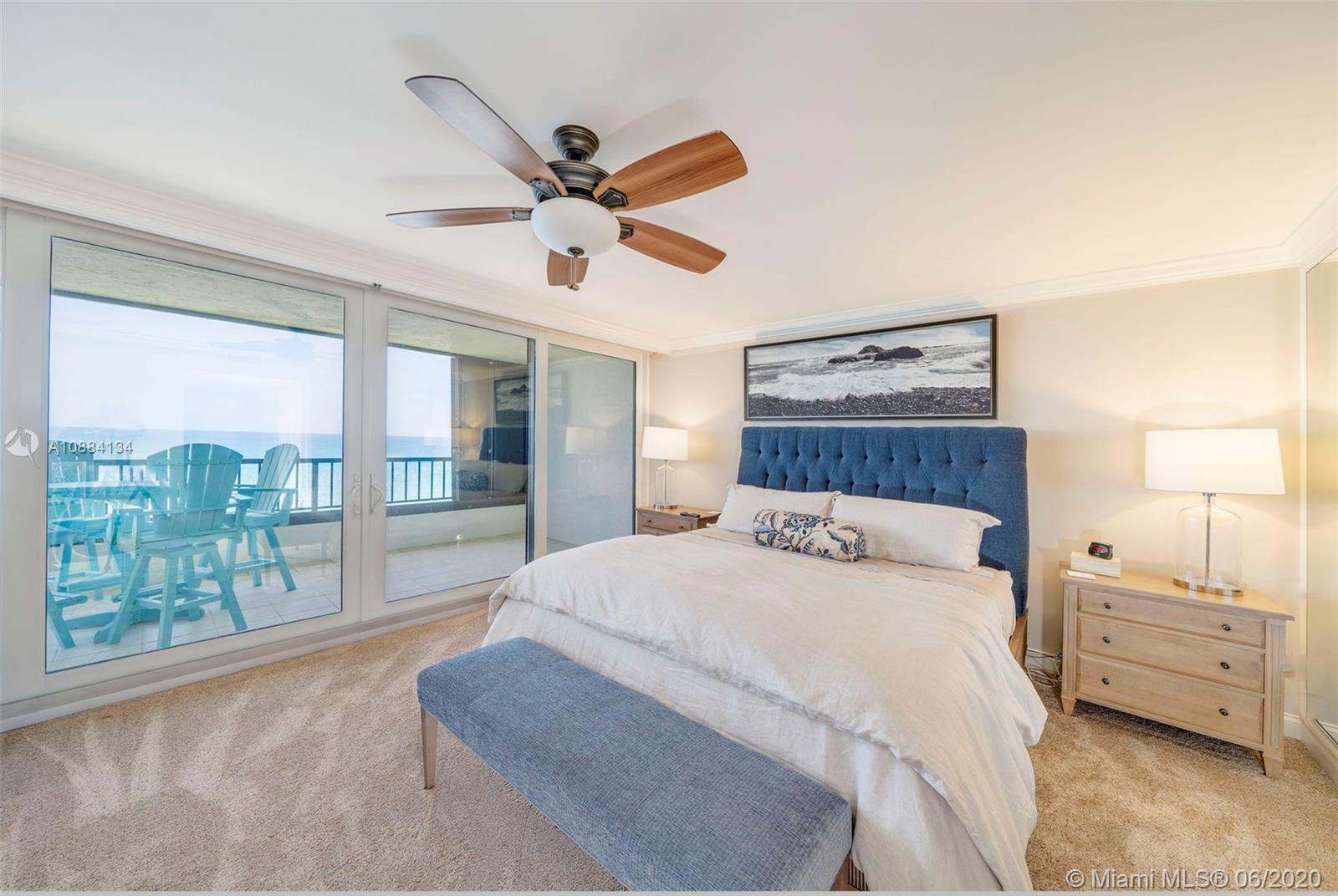 19900 South Beach Road, Unit 803 Jupiter, FL 33469 - Photo 34 of 64 a bedroom with a large bed and a large window
