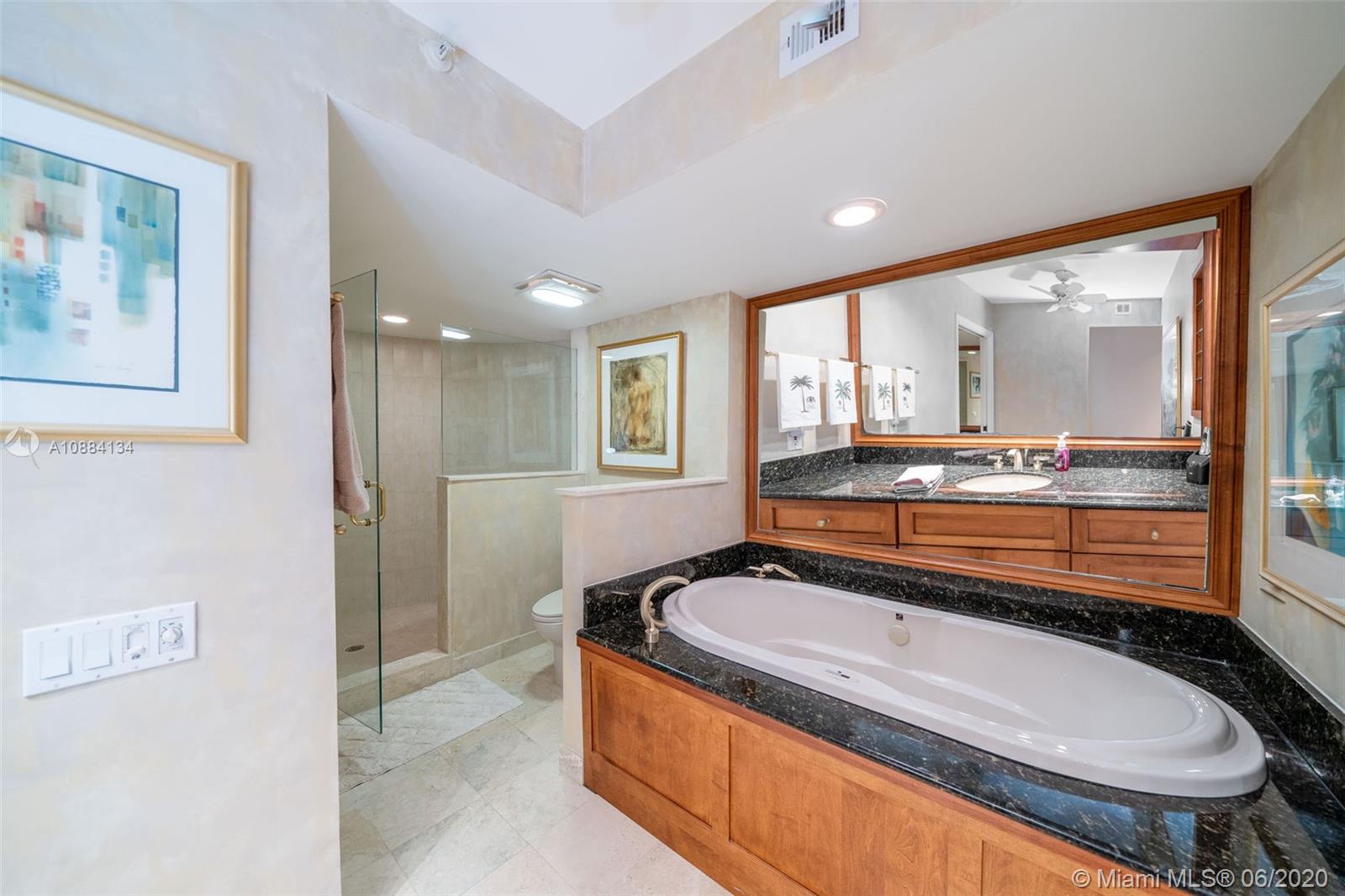 19900 South Beach Road, Unit 803 Jupiter, FL 33469 - Photo 42 of 64 a bathroom with a bathtub and a sink