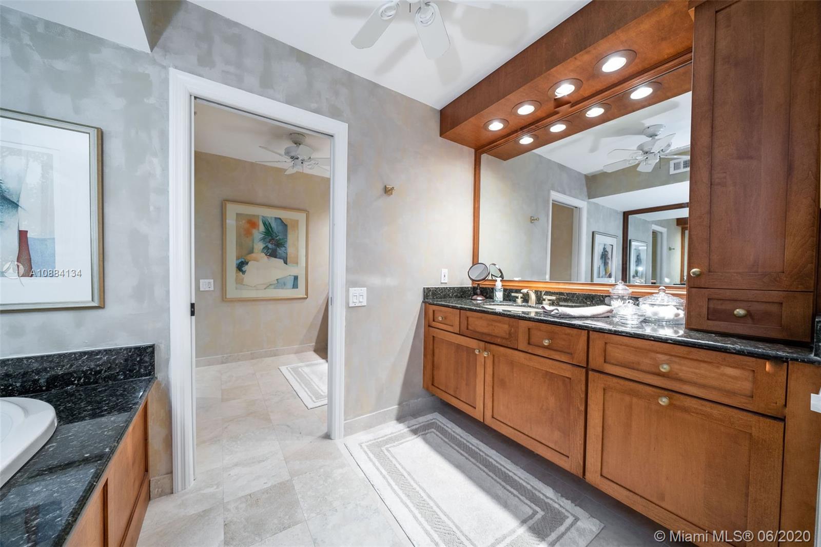19900 South Beach Road, Unit 803 Jupiter, FL 33469 - Photo 43 of 64 a spacious bathroom with a sink a mirror and a shower