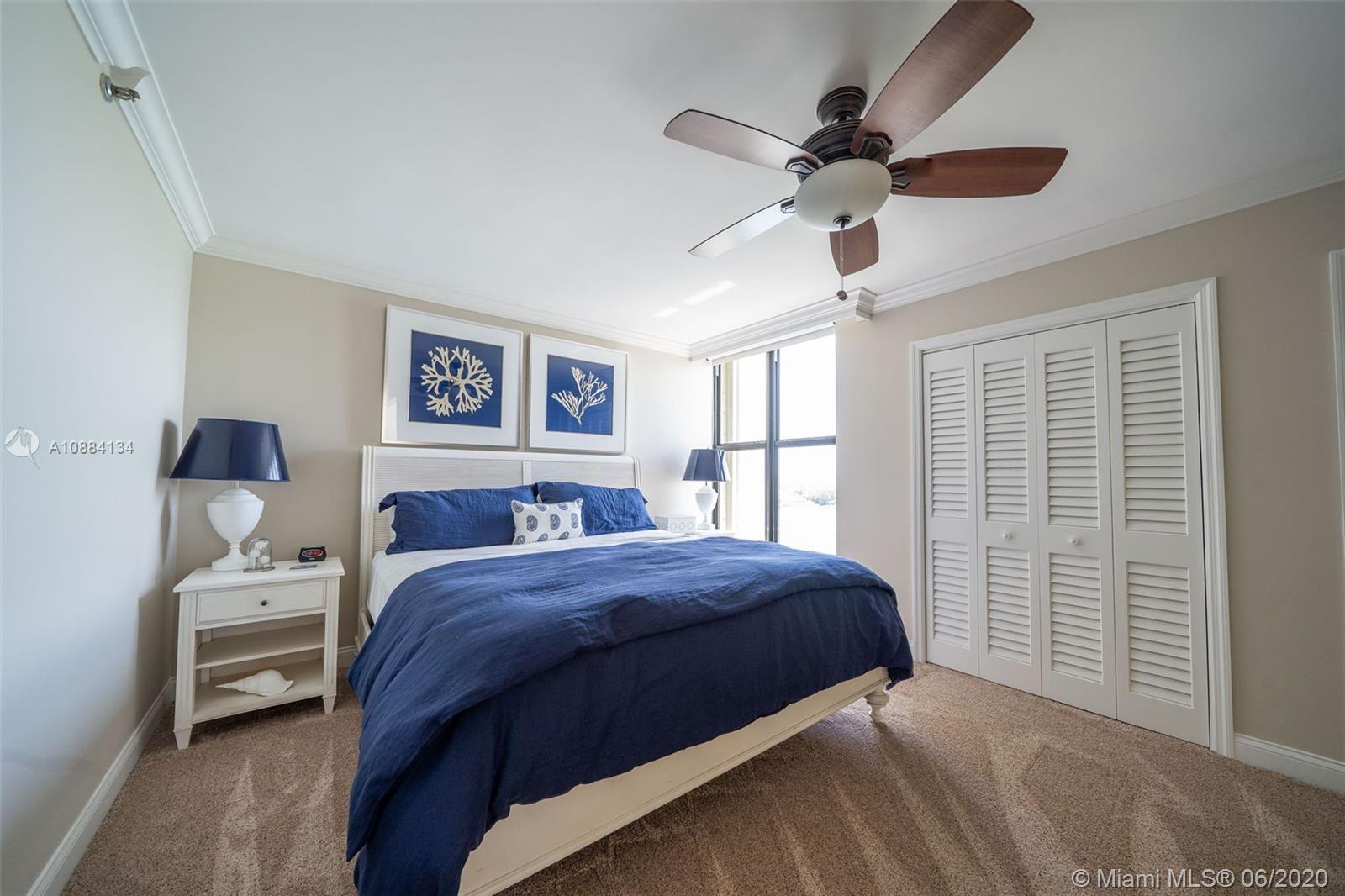 19900 South Beach Road, Unit 803 Jupiter, FL 33469 - Photo 45 of 64 a bedroom with a bed and a window