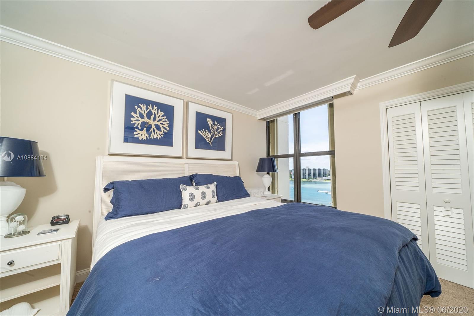 19900 South Beach Road, Unit 803 Jupiter, FL 33469 - Photo 46 of 64 a spacious bedroom with a large bed and a window