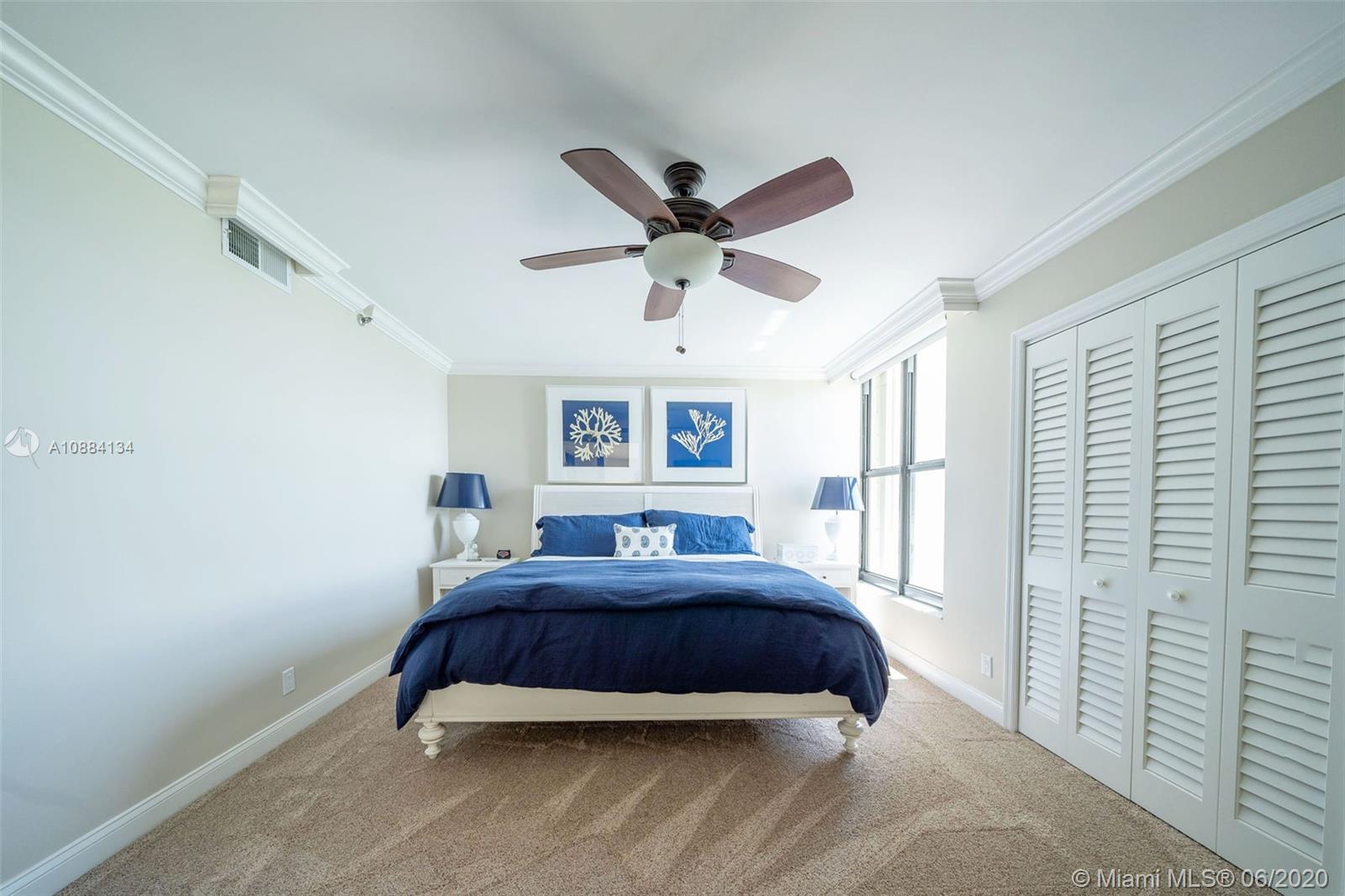 19900 South Beach Road, Unit 803 Jupiter, FL 33469 - Photo 47 of 64 a bedroom with a bed and a window