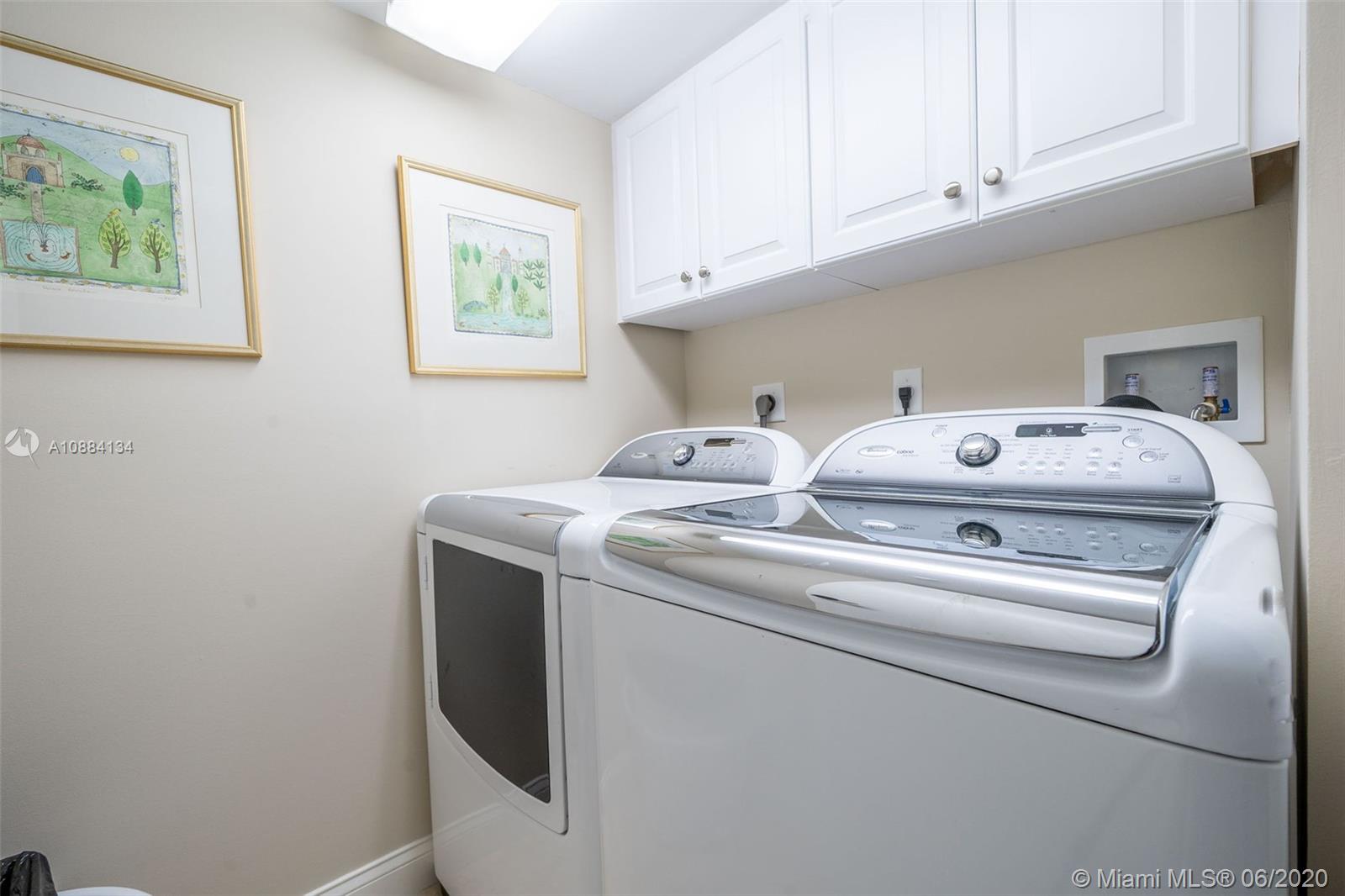 19900 South Beach Road, Unit 803 Jupiter, FL 33469 - Photo 48 of 64 a utility room with dryer and washer