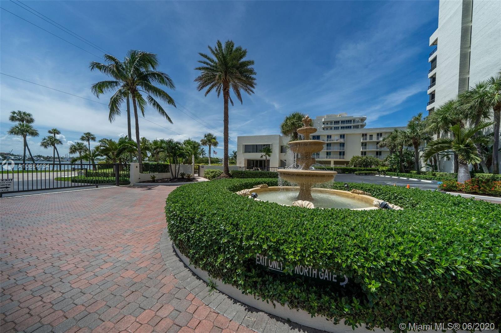19900 South Beach Road, Unit 803 Jupiter, FL 33469 - Photo 54 of 64 a view of a swimming pool with a garden and palm trees