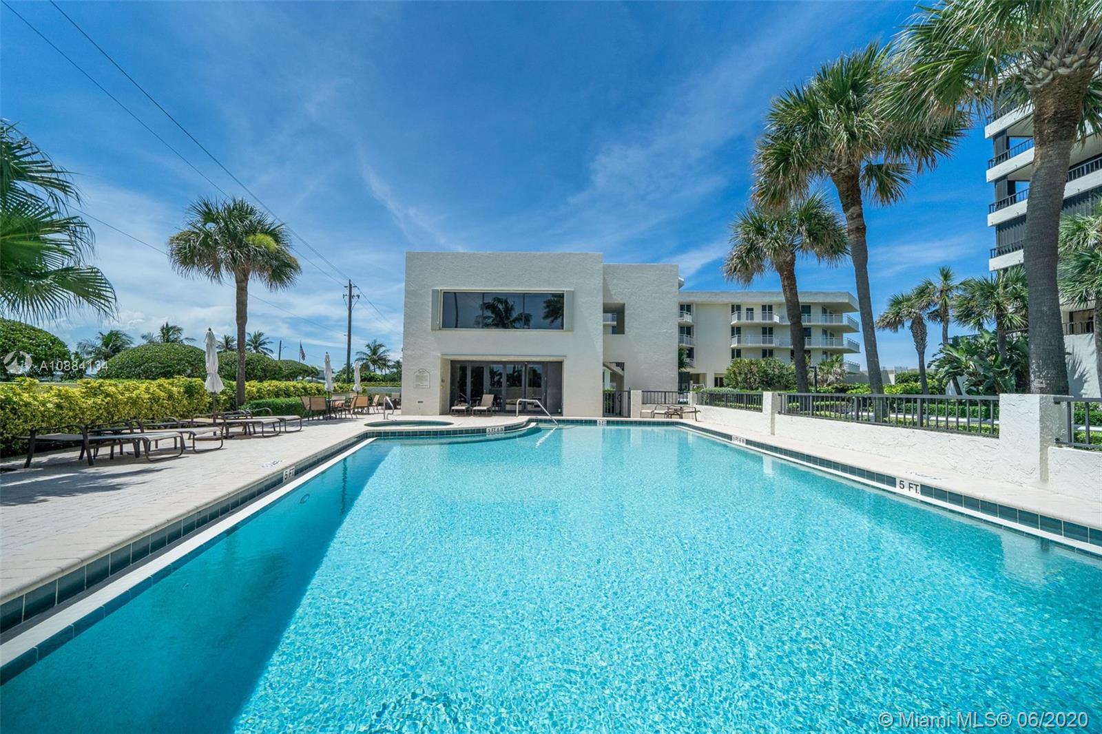 19900 South Beach Road, Unit 803 Jupiter, FL 33469 - Photo 55 of 64 a swimming pool with outdoor seating and yard