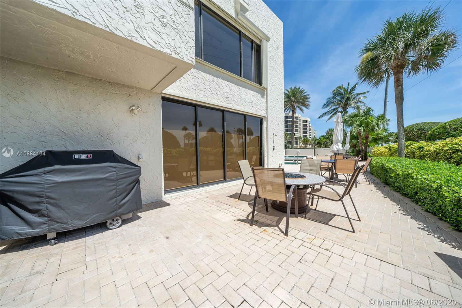 19900 South Beach Road, Unit 803 Jupiter, FL 33469 - Photo 58 of 64 a outdoor space with a couch and chairs