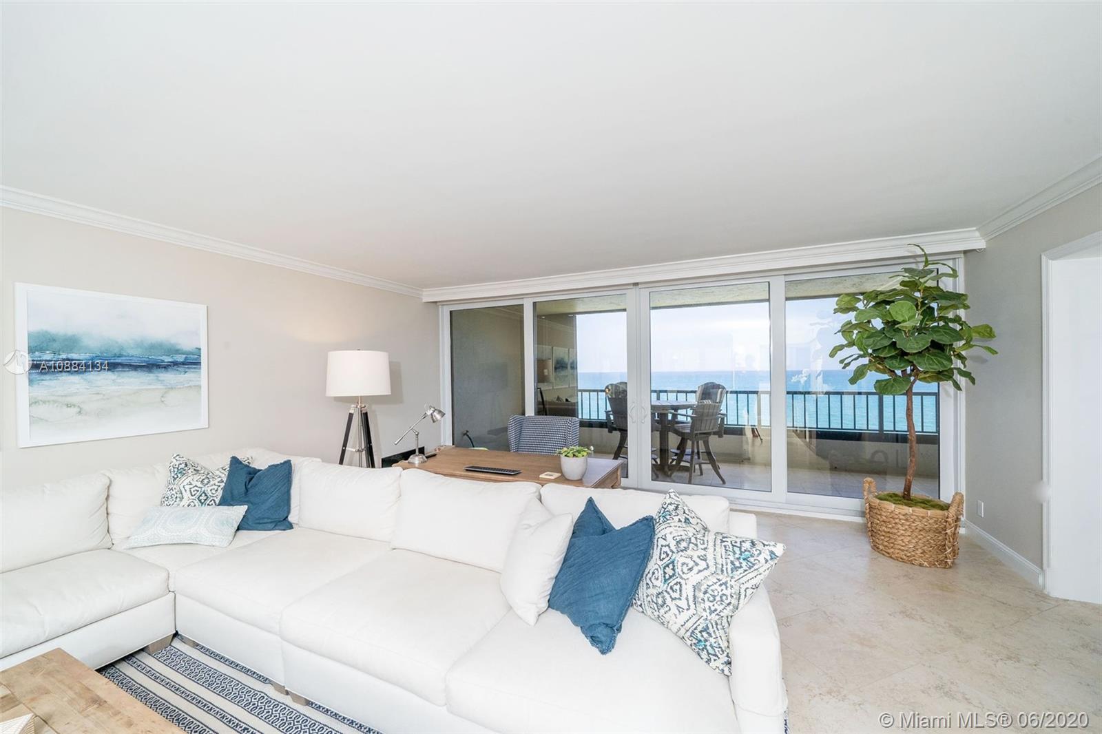 19900 South Beach Road, Unit 803 Jupiter, FL 33469 - Photo 9 of 64 a living room with furniture and a large window