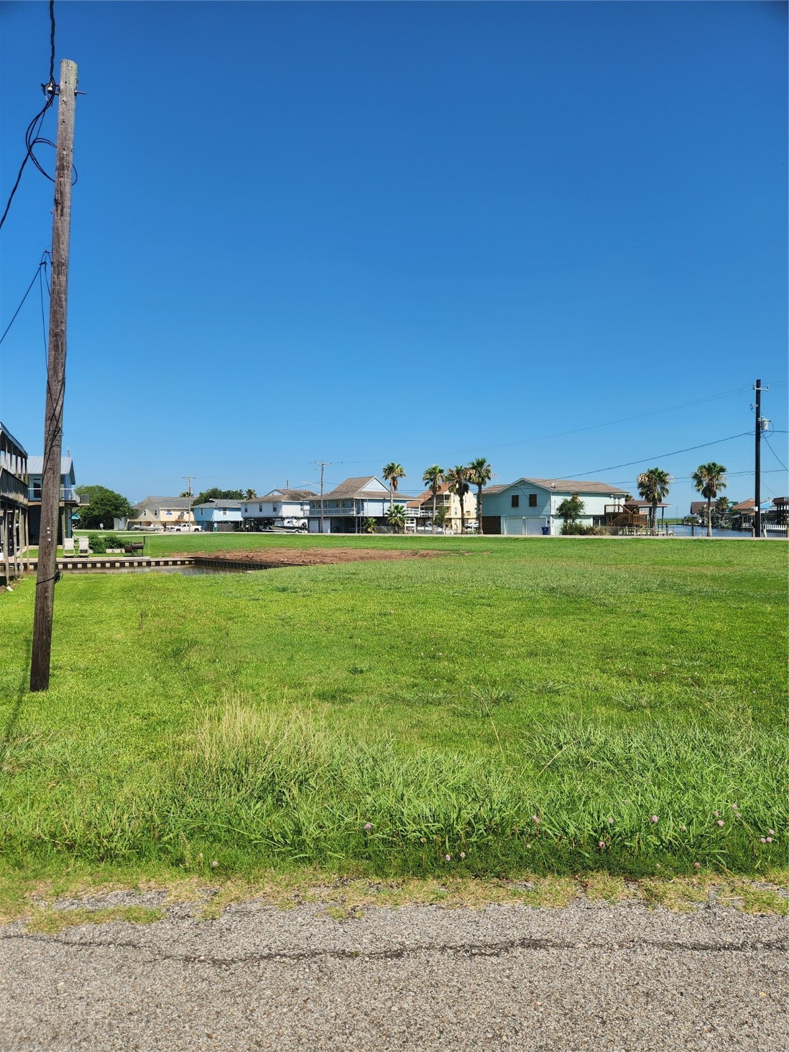 0 Treasure Lane Freeport, TX 77541 - Photo 4 of 7 a view of a grassy field