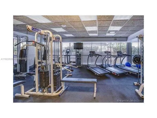 a living room with lots of furniture and a chandelier