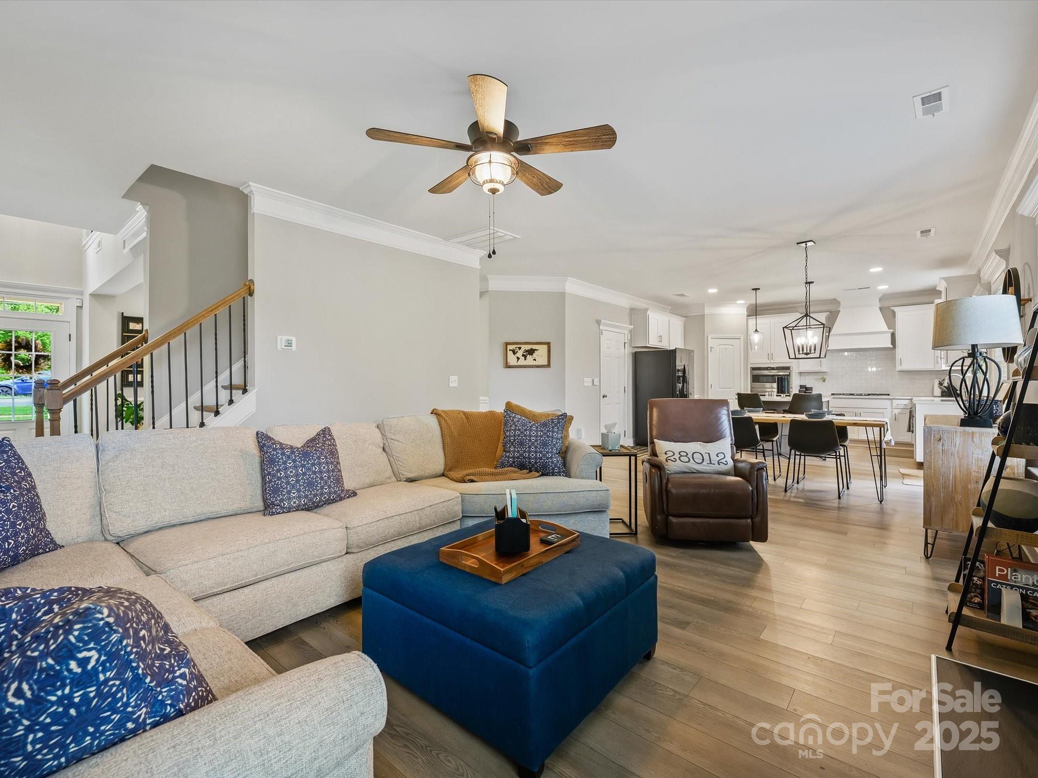 2901 South Point Road Belmont, NC 28012 - Photo 12 of 35 a living room with furniture kitchen view and a chandelier