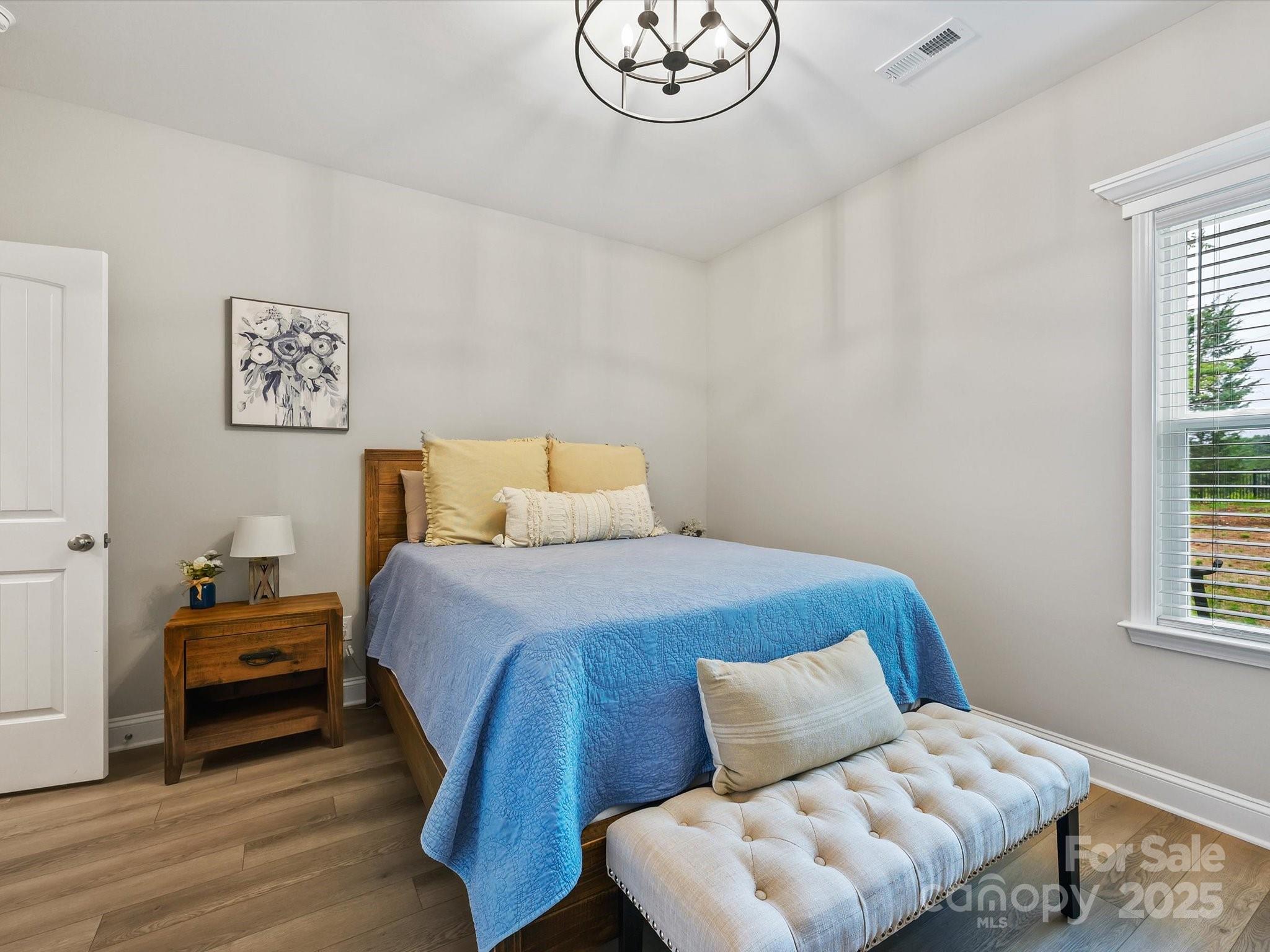 2901 South Point Road Belmont, NC 28012 - Photo 19 of 35 a bedroom with a bed and window