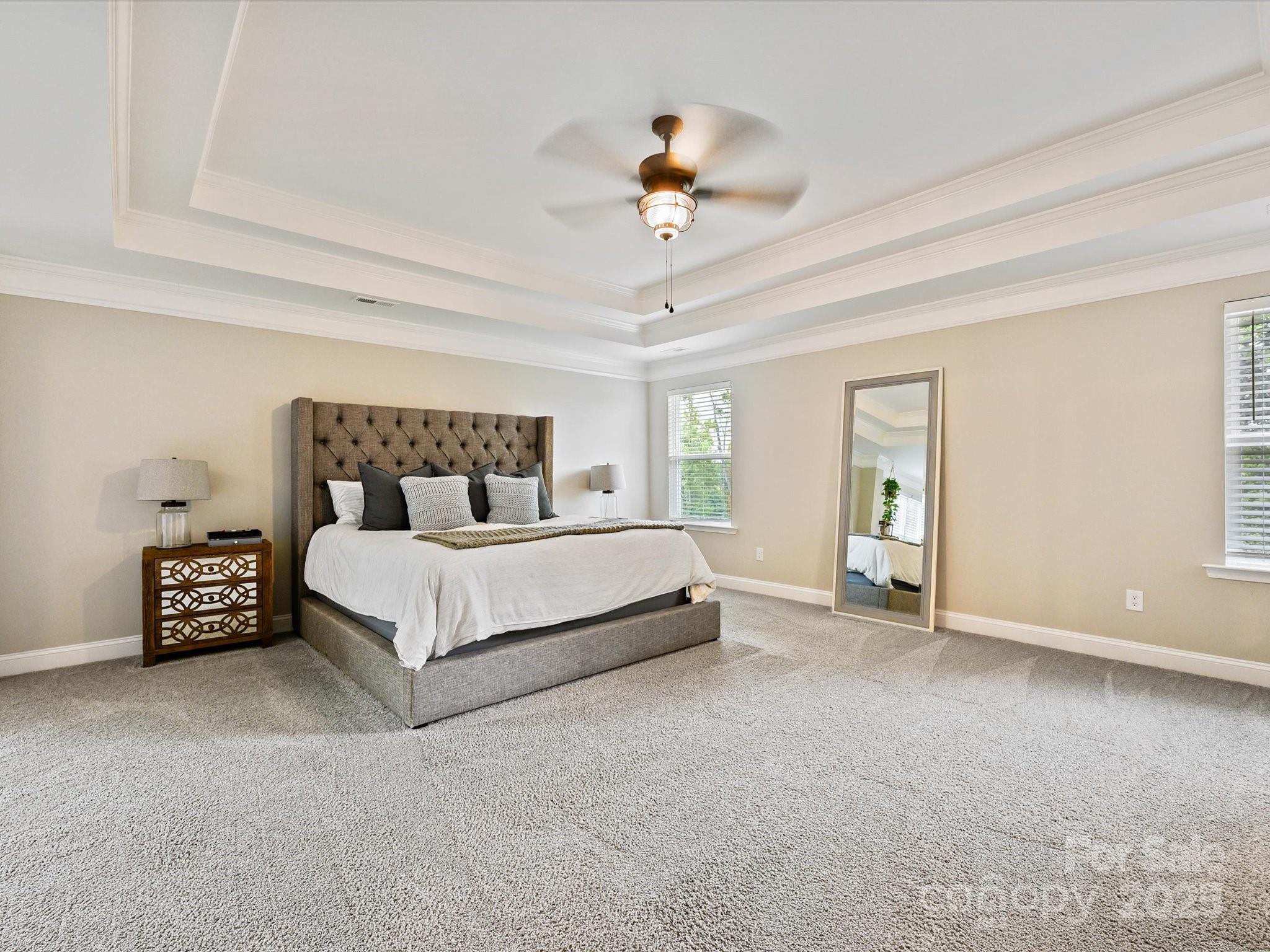 2901 South Point Road Belmont, NC 28012 - Photo 23 of 35 a bedroom with a bed and a chandelier