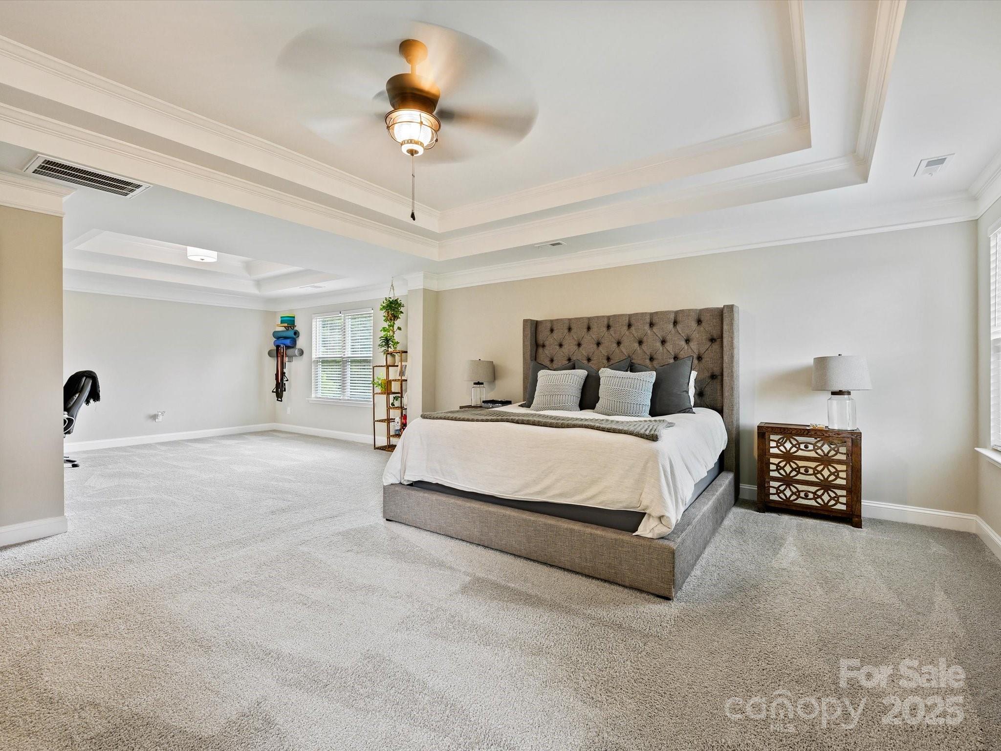 2901 South Point Road Belmont, NC 28012 - Photo 24 of 35 a bedroom with a bed and a chandelier