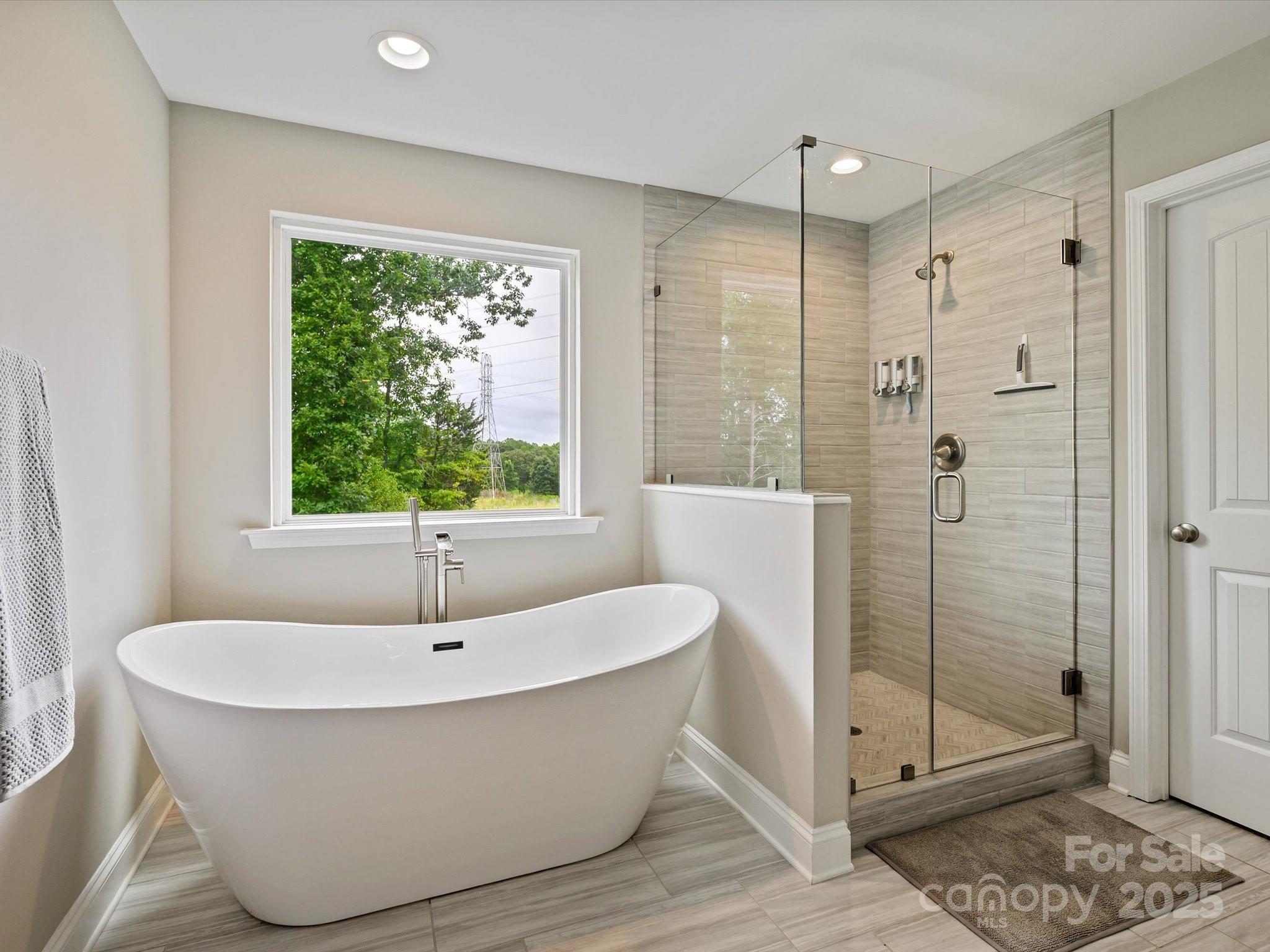 2901 South Point Road Belmont, NC 28012 - Photo 27 of 35 a bathroom with a bathtub and shower