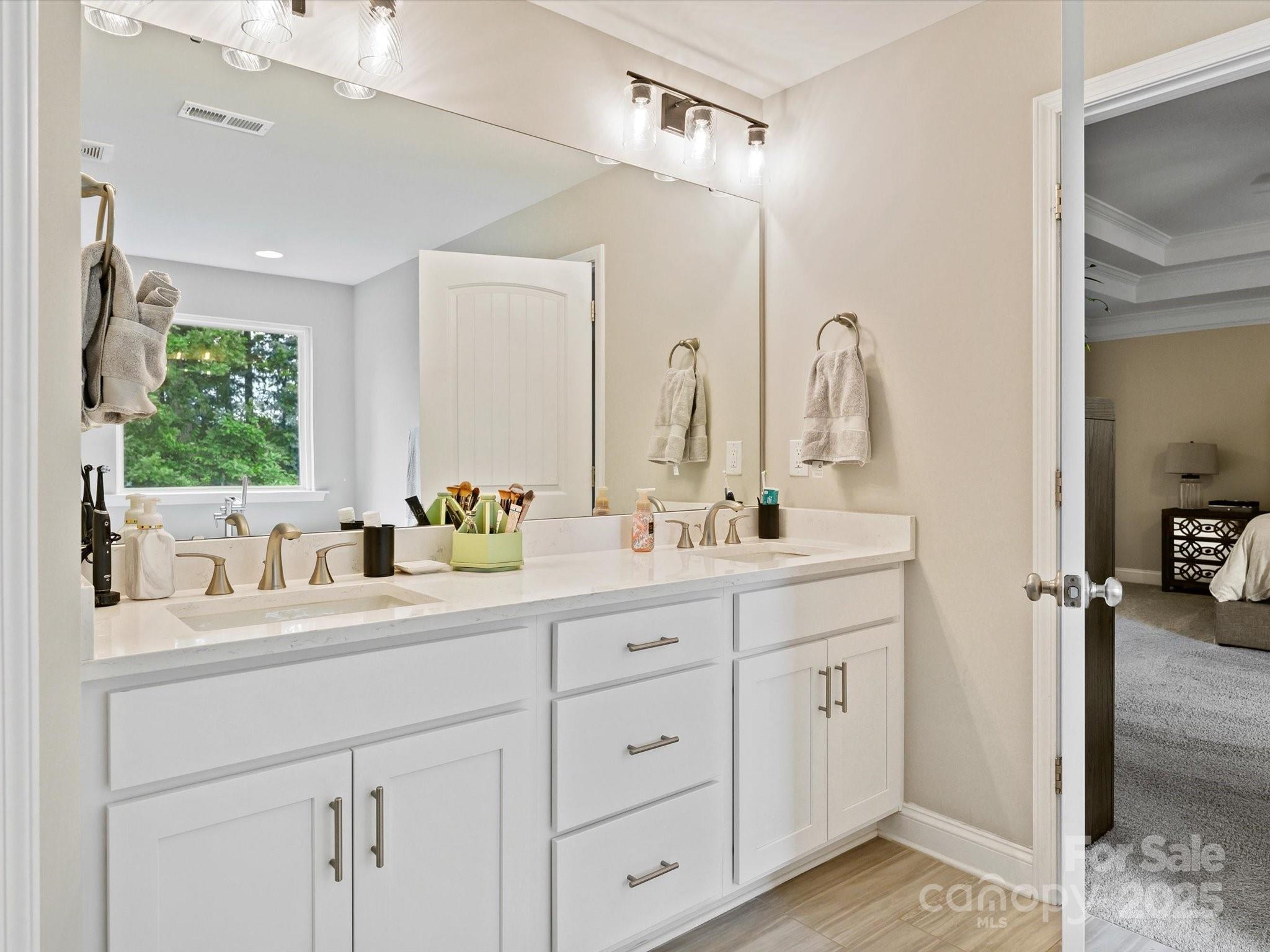 2901 South Point Road Belmont, NC 28012 - Photo 28 of 35 a bathroom with double sink and a mirror