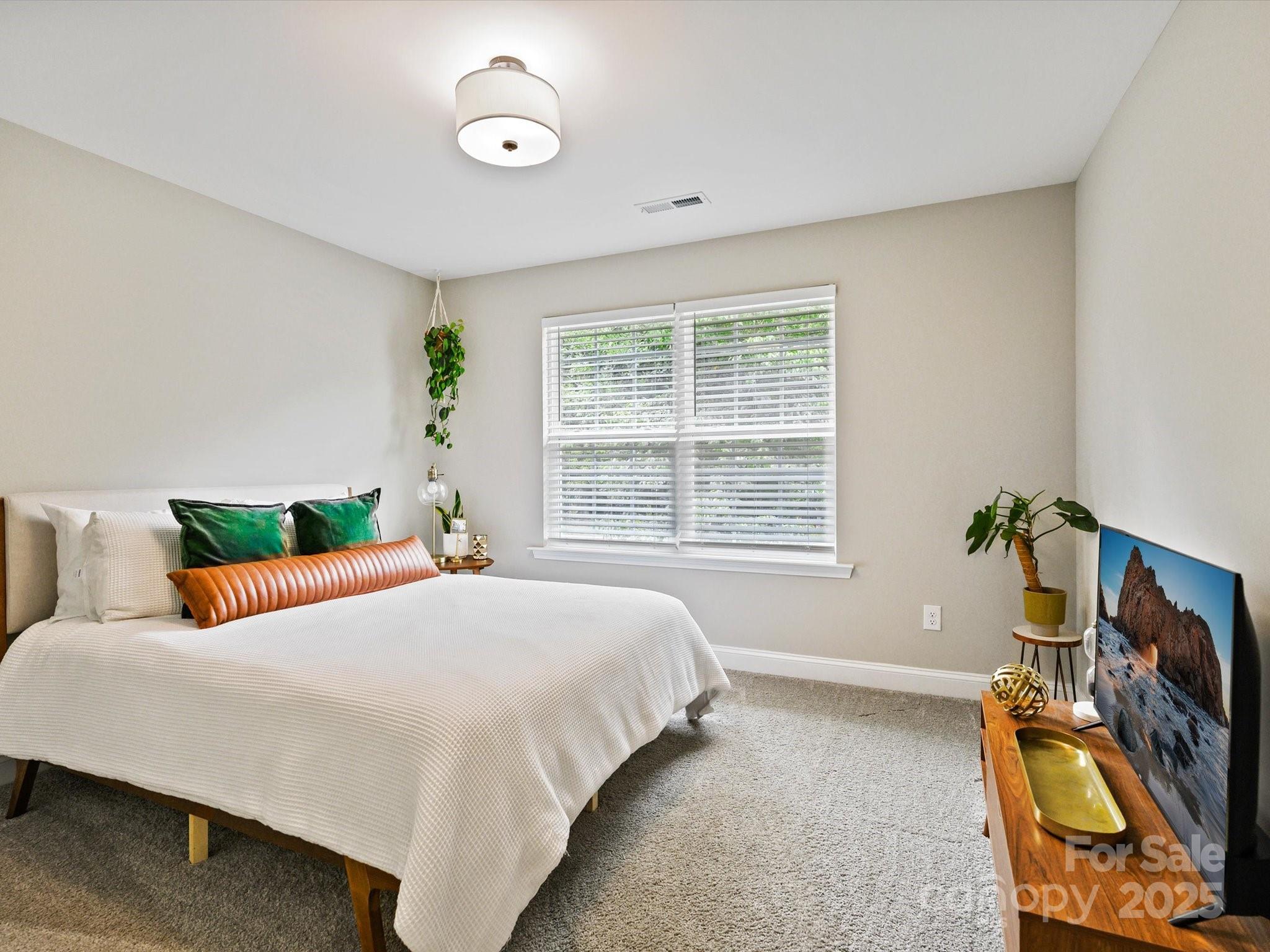 2901 South Point Road Belmont, NC 28012 - Photo 30 of 35 a bedroom with a bed and a window